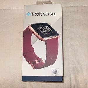 Fitbit versa, maroon color. Used… comes with charger